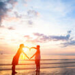 Lovers with their feet in the water