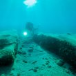 Archaeological diver in shallow water